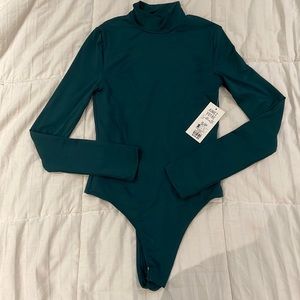 Dark green turtleneck bodysuit